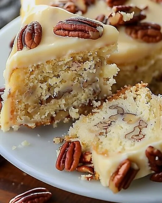 Delicious Butter Pecan Bliss Cake topped with pecans and creamy frosting