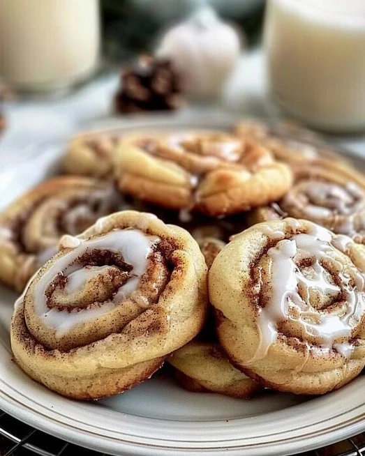 Cinnamon Roll Cookies 2 Freshly baked cinnamon roll cookies topped with icing