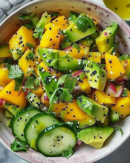 Cucumber Mango Avocado Salad 2 Colorful Cucumber Mango Avocado Salad in a bowl with fresh ingredients