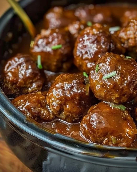 Slow Cooker Salisbury Steak Meatballs 2 Slow Cooker Salisbury Steak Meatballs served with gravy over mashed potatoes.
