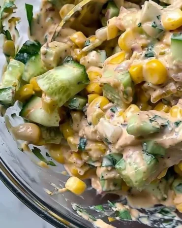 Creamy street corn cucumber salad with fresh ingredients and seasonings