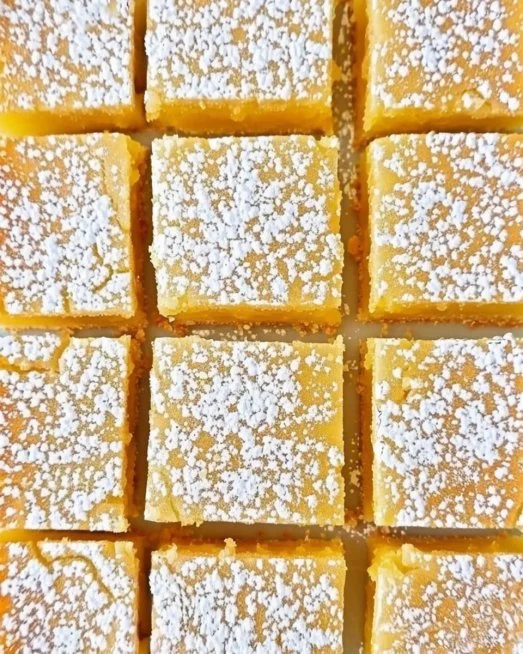 Super Easy Lemon Bars 2 Delicious super easy lemon bars with a vibrant lemon drizzle