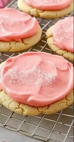 Delicious Crumbl pink sugar cookies with a sweet frosting topping.